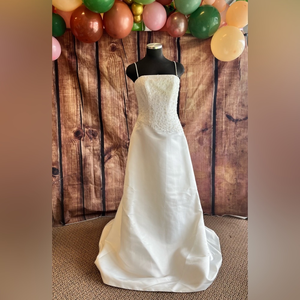 White thin strapped wedding dress with a beaded bodice